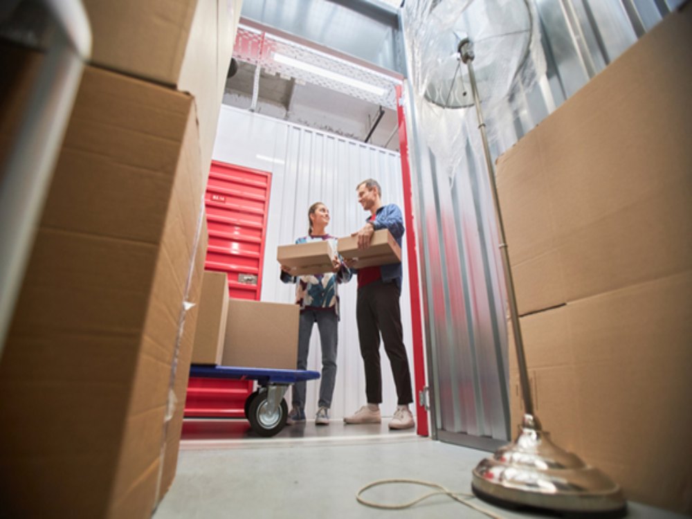 Couple renting a self storage unit at a secure facility
